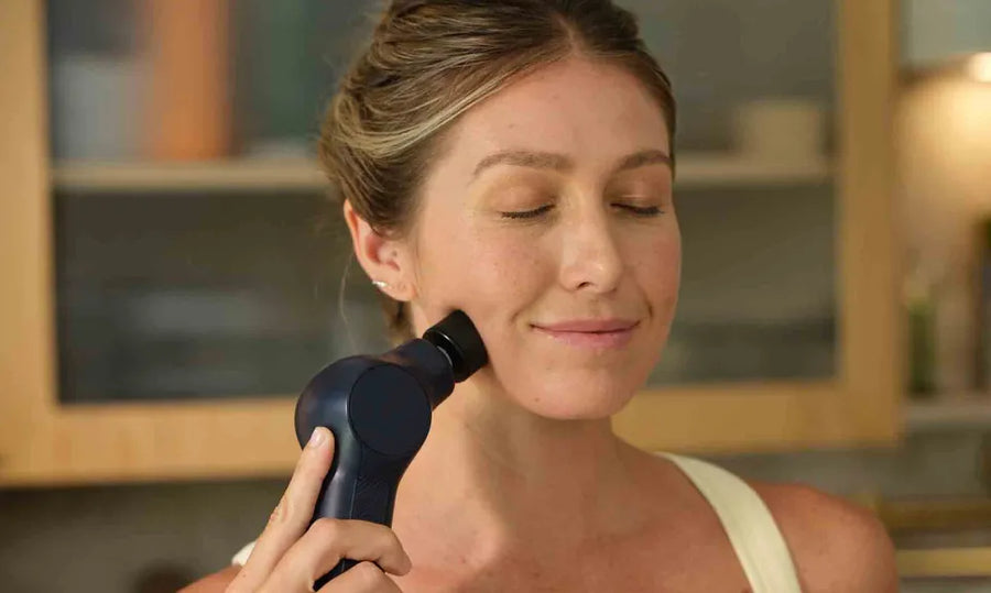 Heated percussive facial massage