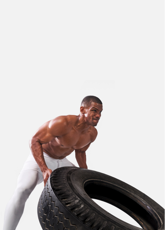 Man working arms out with tire