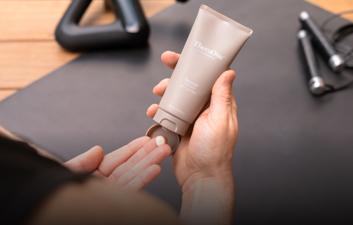 Person using TheraOne Recover Lotion