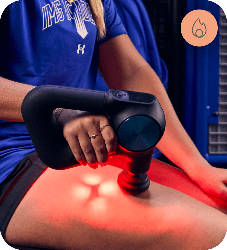 woman using Theragun PRO Plus device on thigh