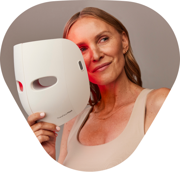 woman holding theraface mask