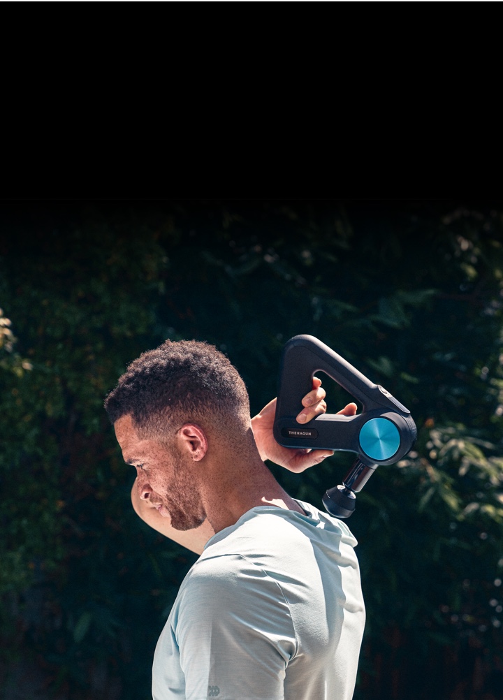 Man using device on shoulder